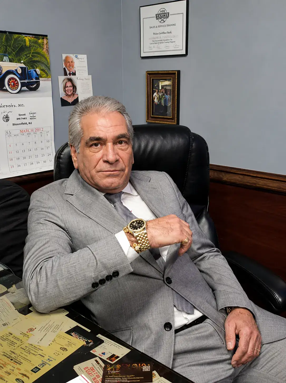 Phil Green, founder of GreenRose Production Studios, at his office desk